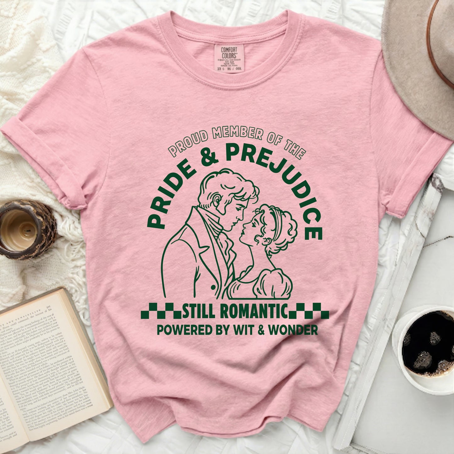 Pink t-shirt with Pride & Prejudice graphic and text.