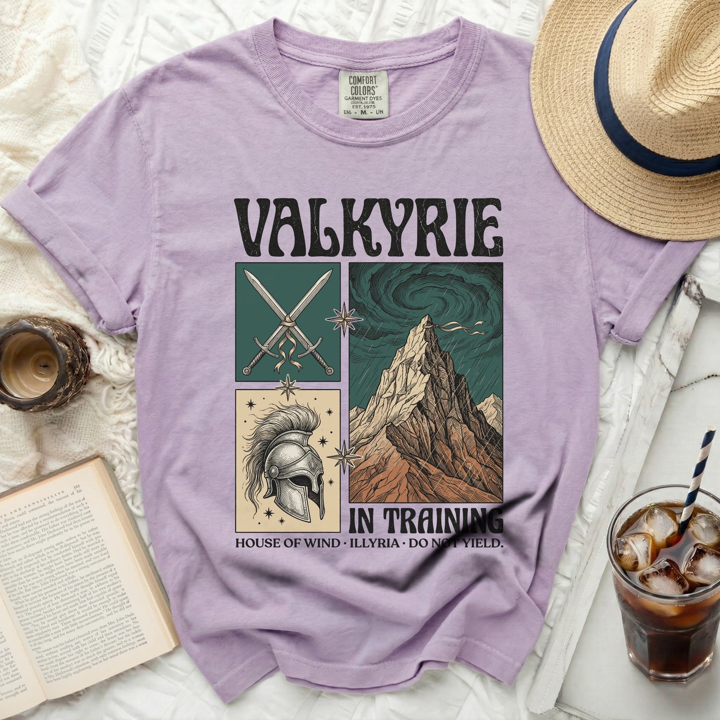 Purple t-shirt with "VALKYRIE IN TRAINING" graphic and illustrations.