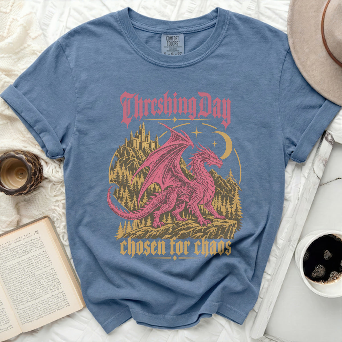 Blue t-shirt with pink dragon, castle, and text "Threshing Day chosen for chaos".