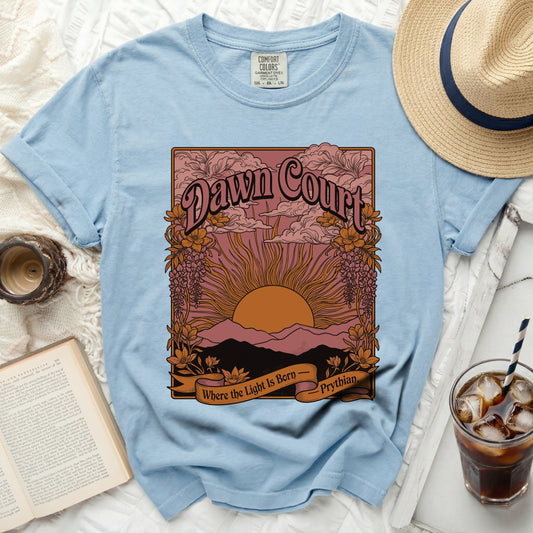 Light blue t-shirt with "Dawn Court" and sunset design.