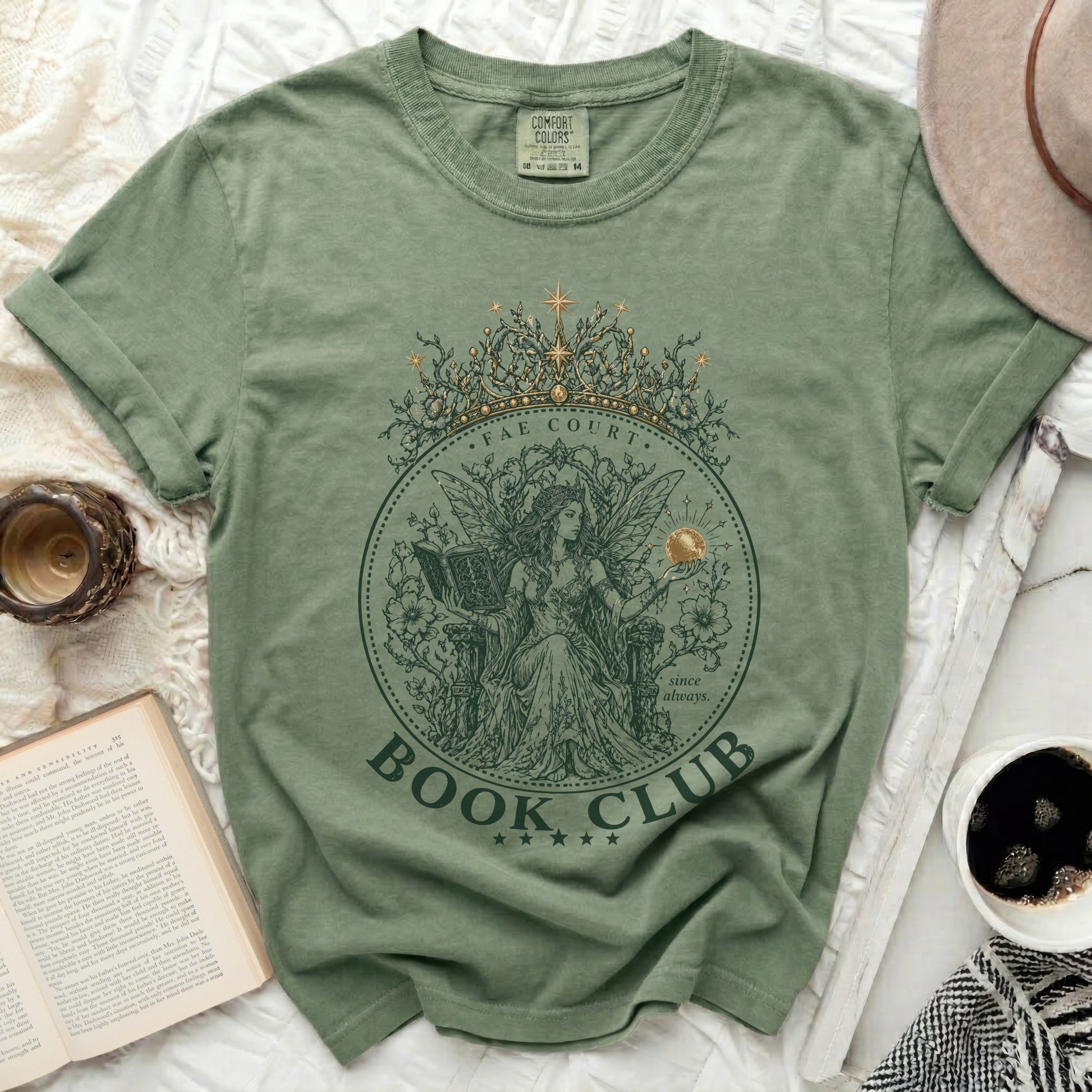 Sage green t-shirt with "FAE COURT BOOK CLUB" text and celestial crown graphic.