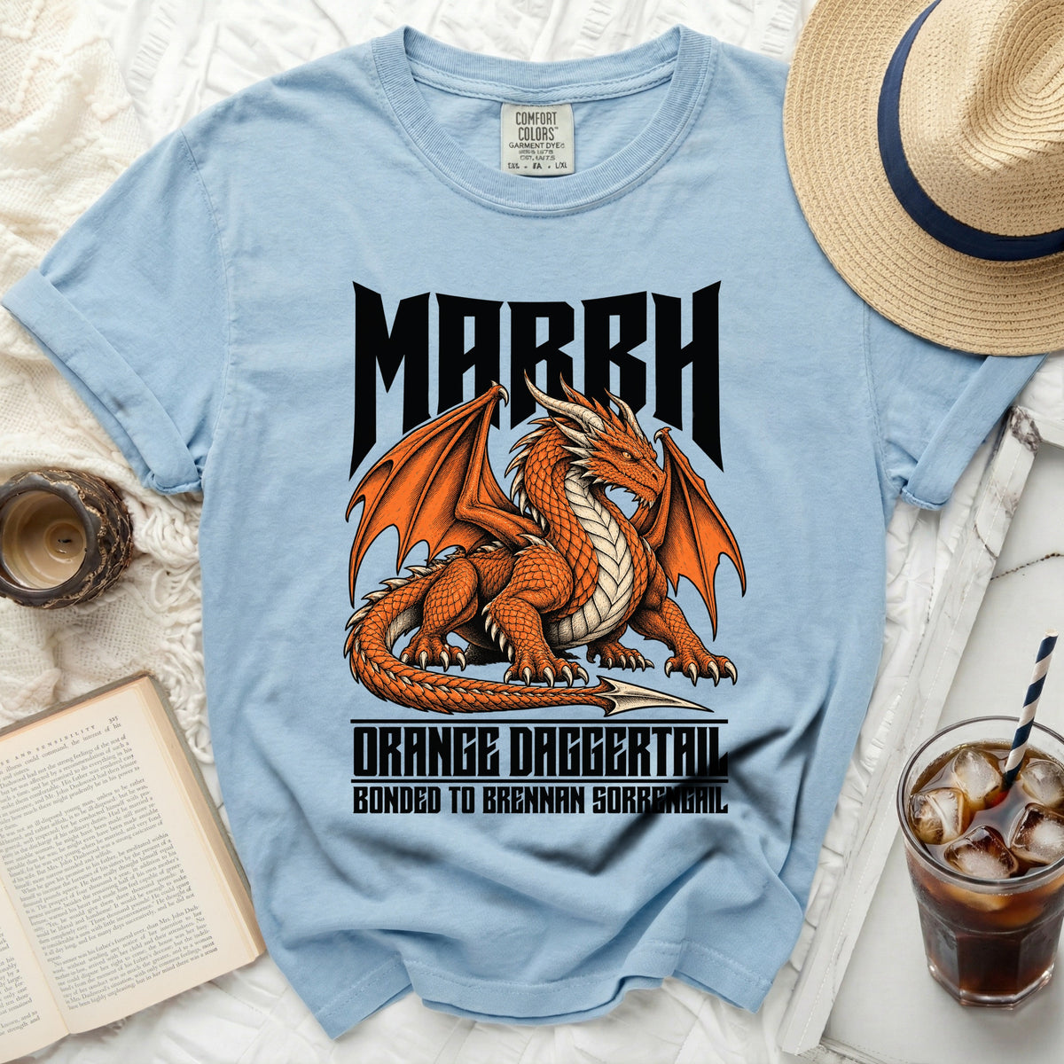 Light blue t-shirt with a dragon graphic reading "MARCH" and "ORANGE DAGGERTAIL BONDED TO BRENNAN SORRENGAIL".