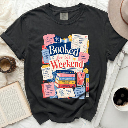 T-shirt with "Booked for the Weekend" and reading-themed graphics.