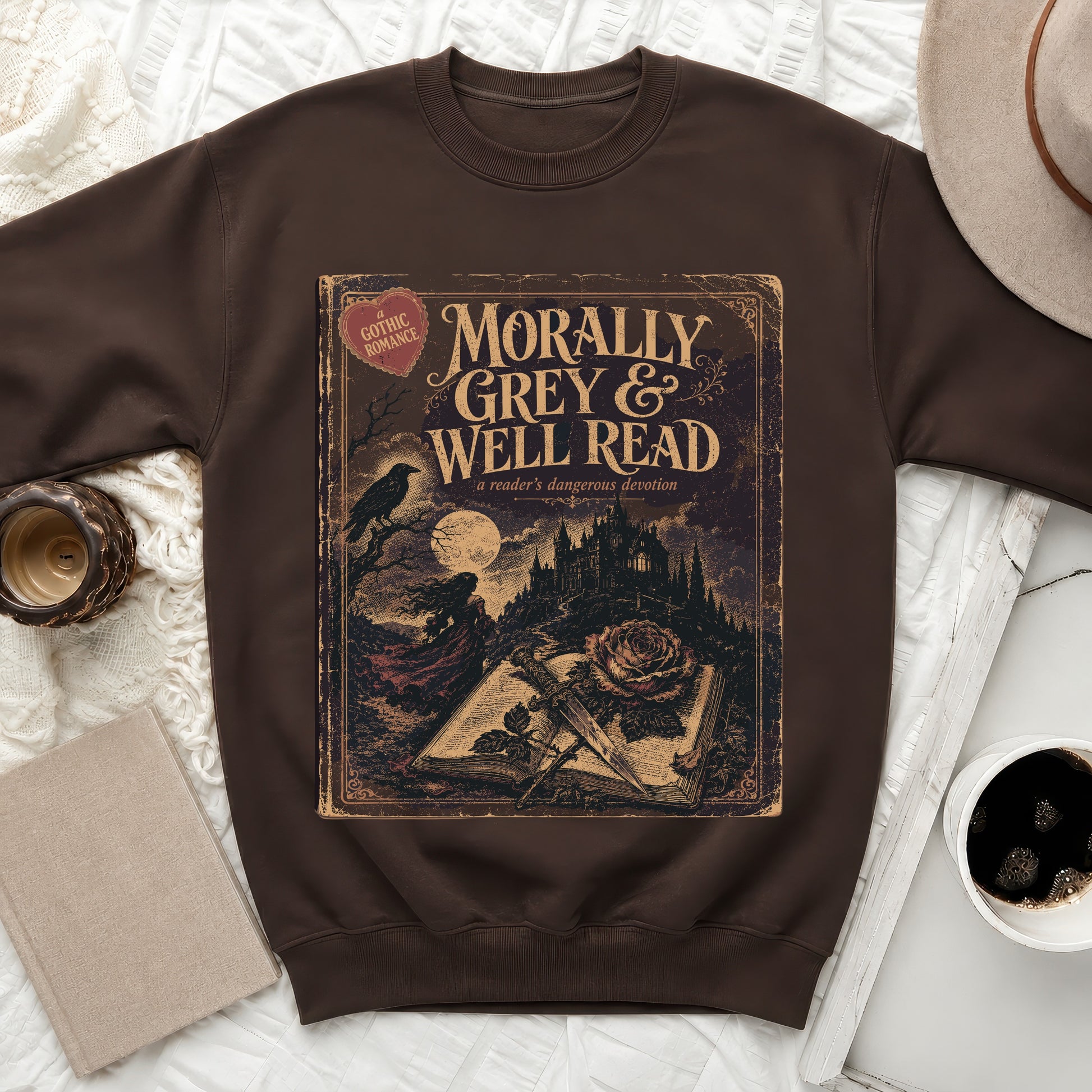 Brown sweatshirt with a "Morally Grey & Well Read" book cover design.