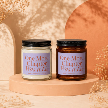 Two candles with text "One More Chapter Was a Lie" on purple labels.