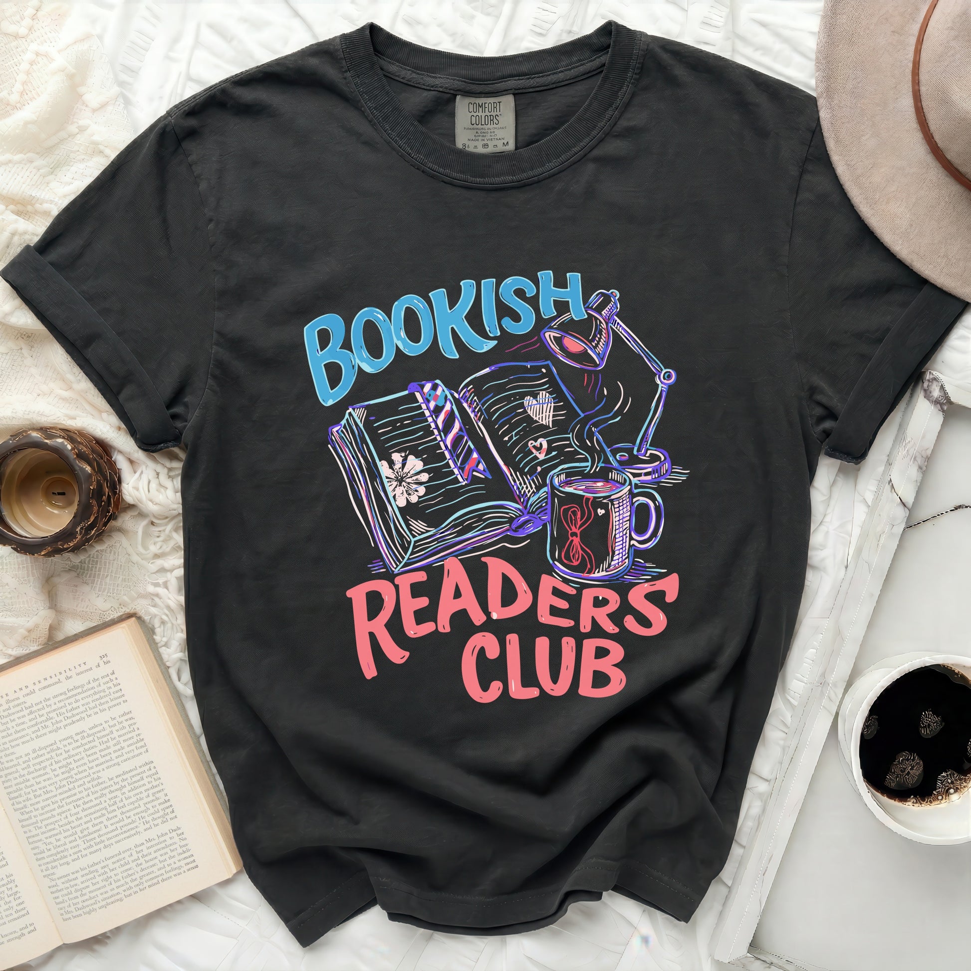 Bookish Readers Club t-shirt with graphic of books, lamp, and coffee.