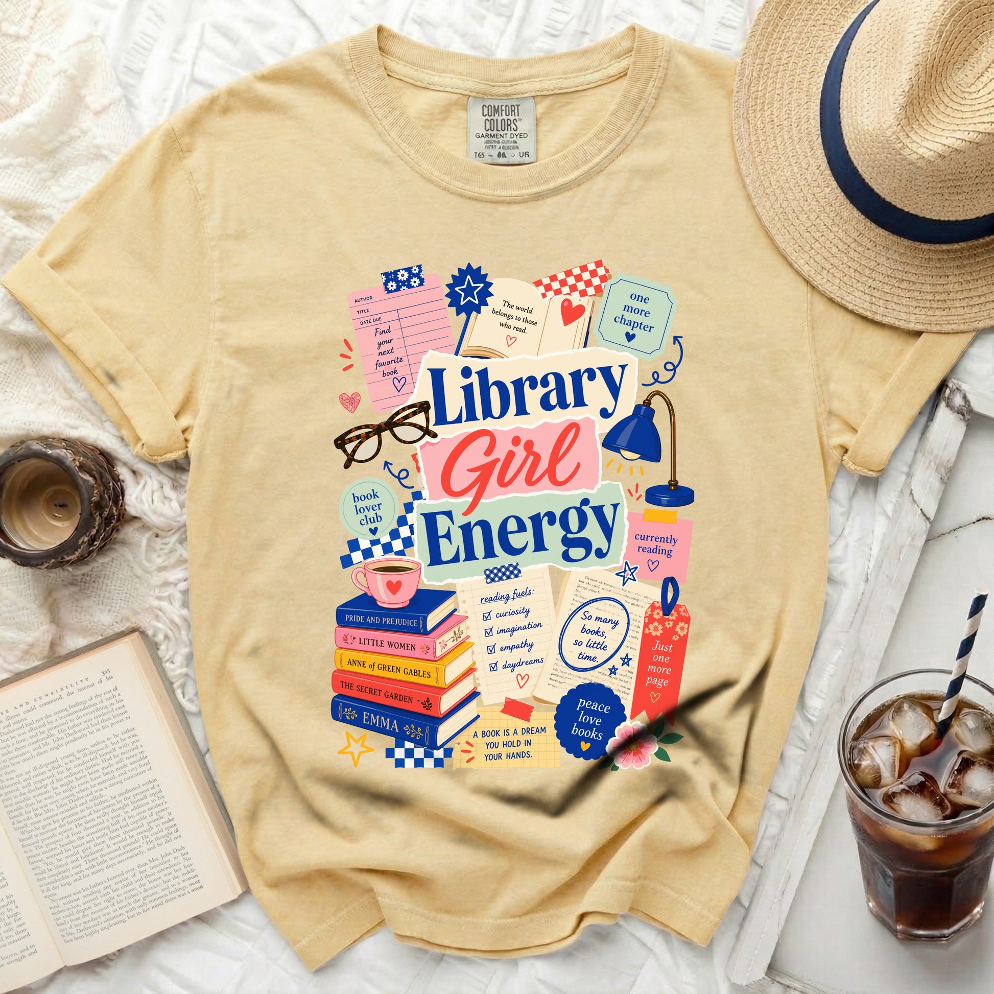 Yellow t-shirt with "Library Girl Energy" graphic and book-themed illustrations.