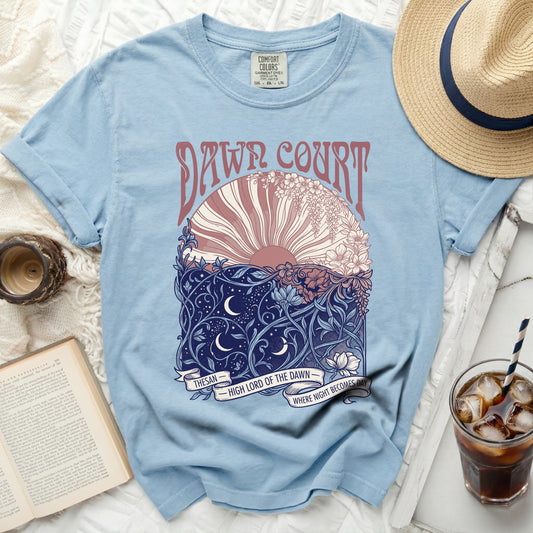 Light blue t-shirt with "Dawn Court" and floral sun design.