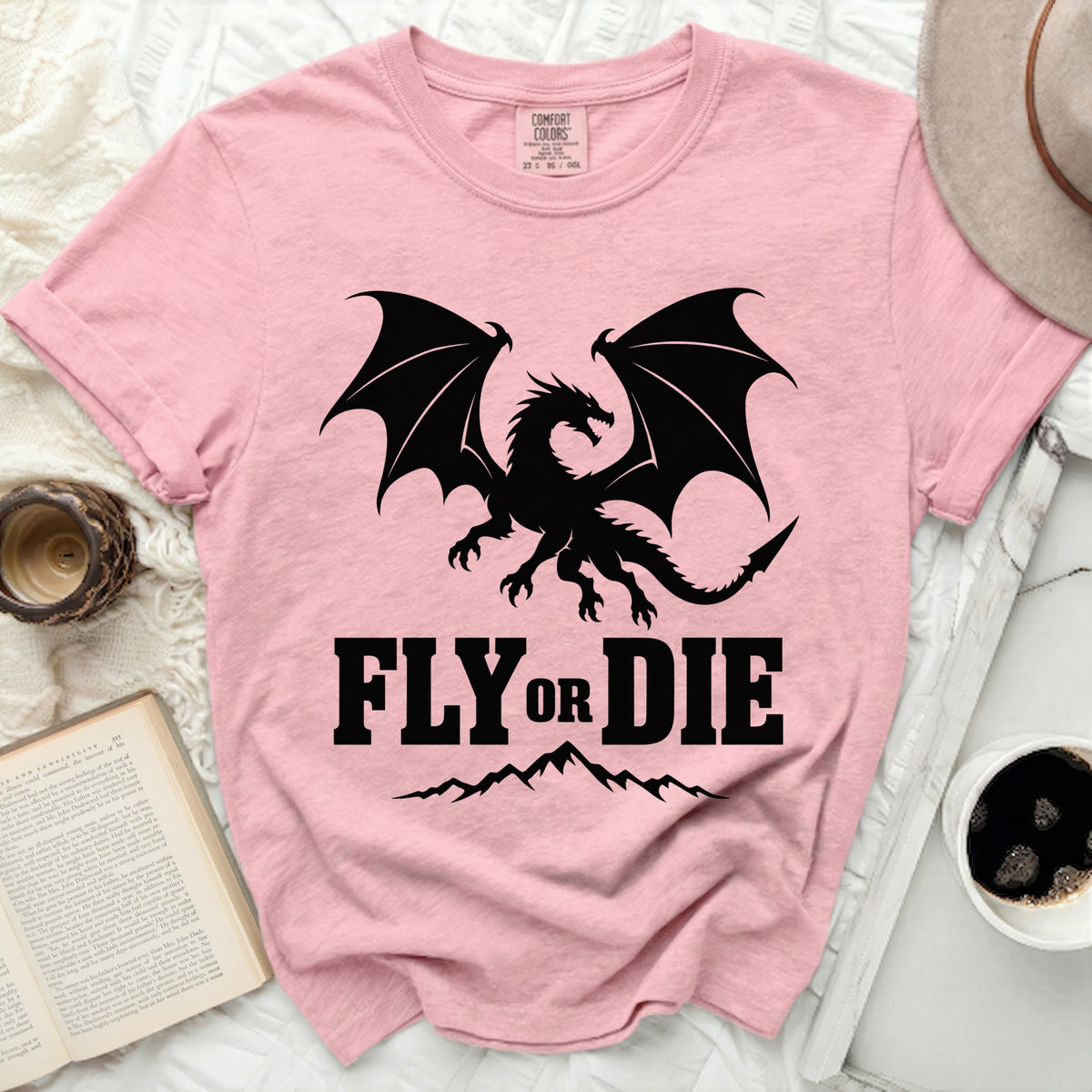 Pink t-shirt with black dragon and "FLY OR DIE" text.