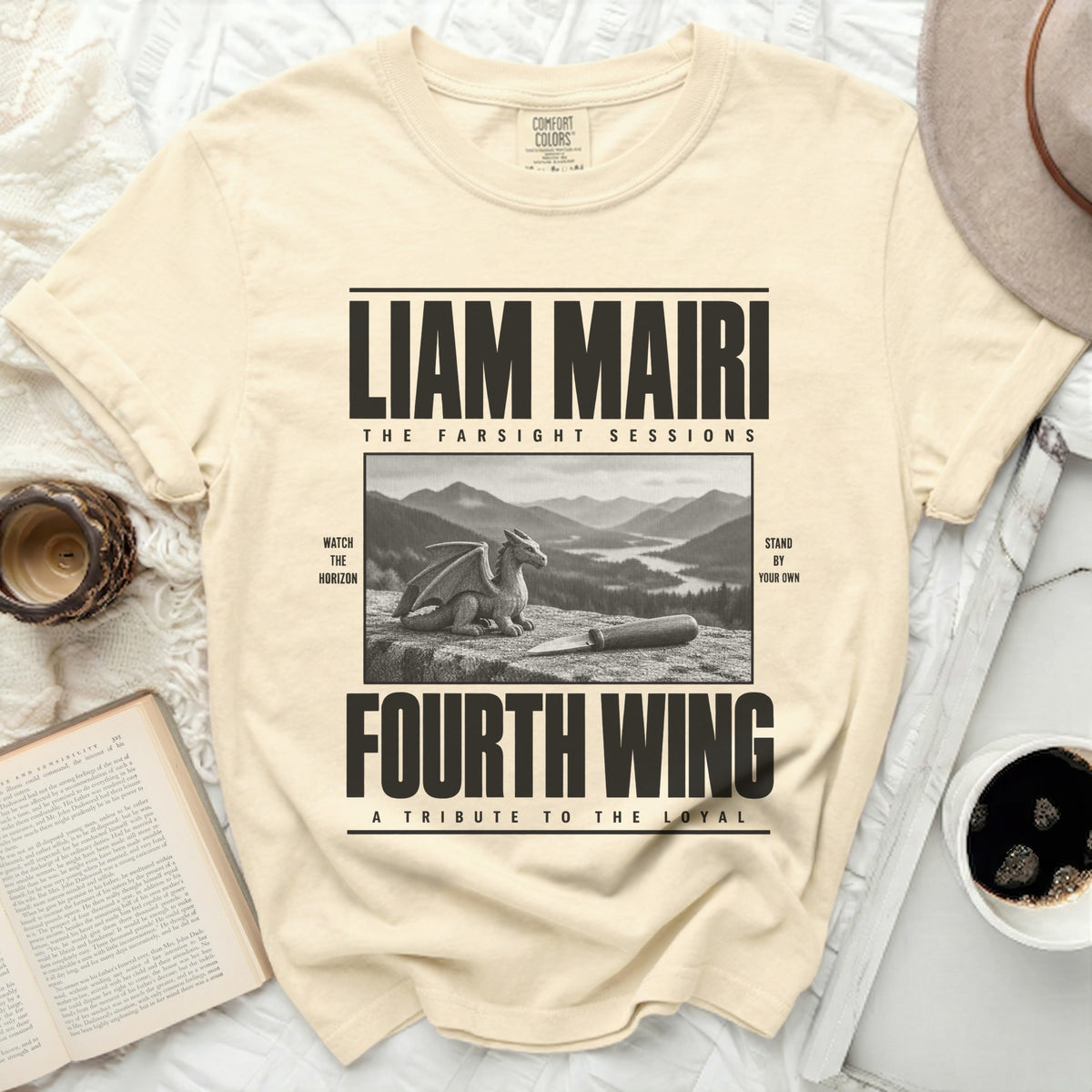 Cream t-shirt with "Liam Mairi Fourth Wing" text and dragon graphic.