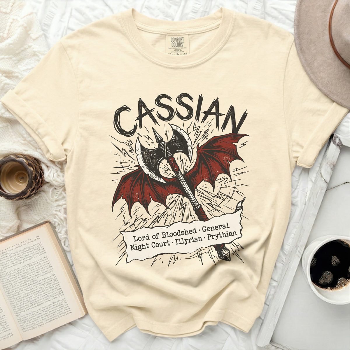Cream t-shirt with "Cassian Lord of Bloodshed General Night Court Illyrian Prythian" text and an axe.