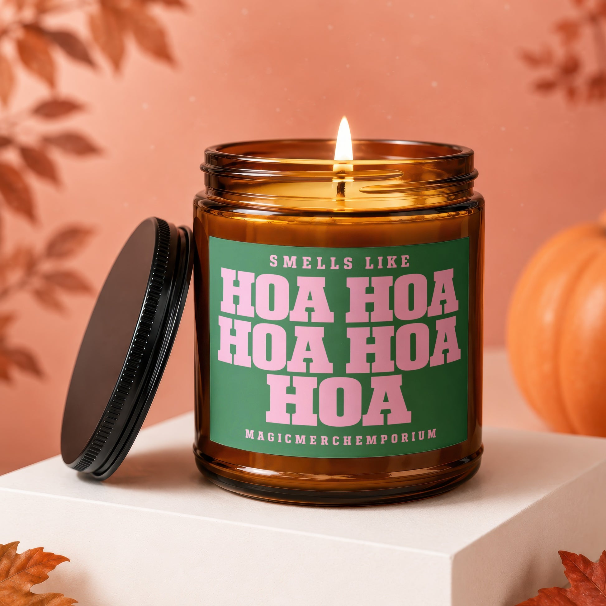 Scented candle with "Smells Like Hoa Hoa Hoa" text on a green label.
