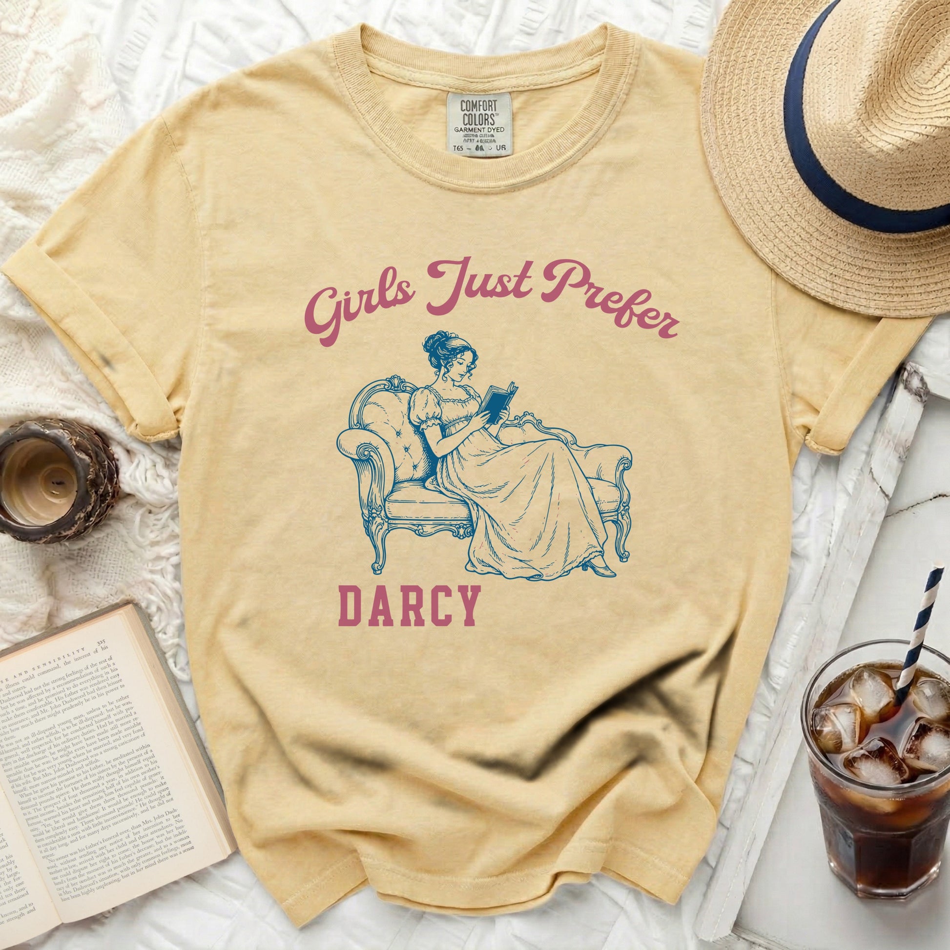 Yellow t-shirt with "Girls Just Prefer Darcy" text and illustration.
