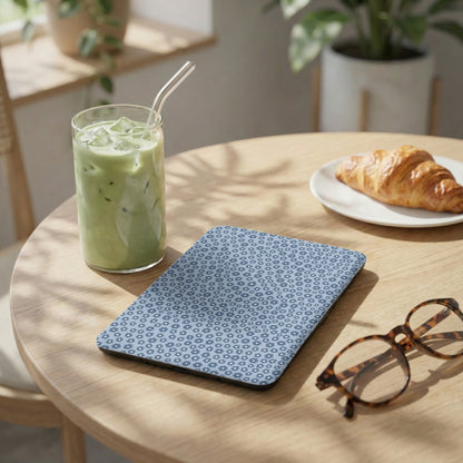 Blue Patterned Case on Wooden Table with Iced Green Drink