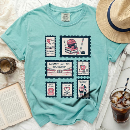 Comfort Colors t-shirt with stamp-themed graphics of hockey and romance.
