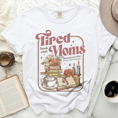 Tired Moms book club graphic with books, coffee, and candles.