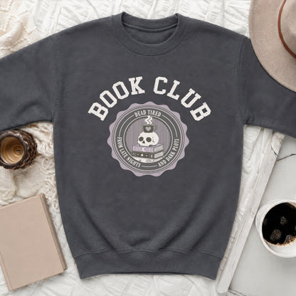 Crewneck sweatshirt with "Book Club" and skull, coffee, and book graphic.