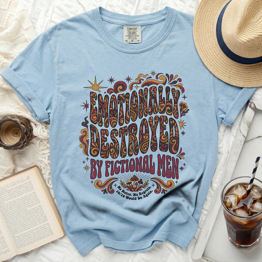 Light blue t-shirt with "Emotionally Destroyed by Fictional Men" graphic.
