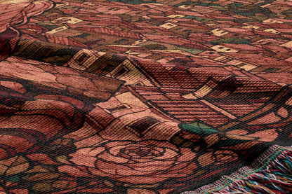 The image is a close-up of a textured fabric with a floral pattern, featuring a rose and other floral elements.