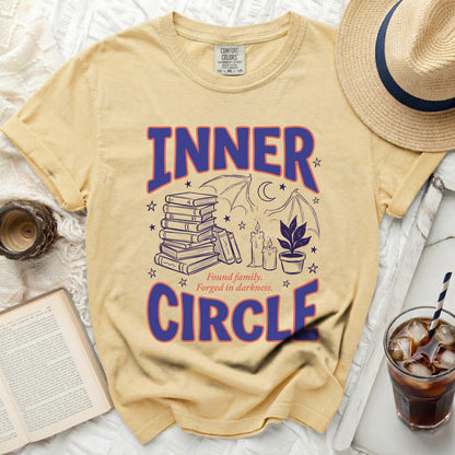 Yellow t-shirt with "INNER CIRCLE" text and occult-themed graphics.