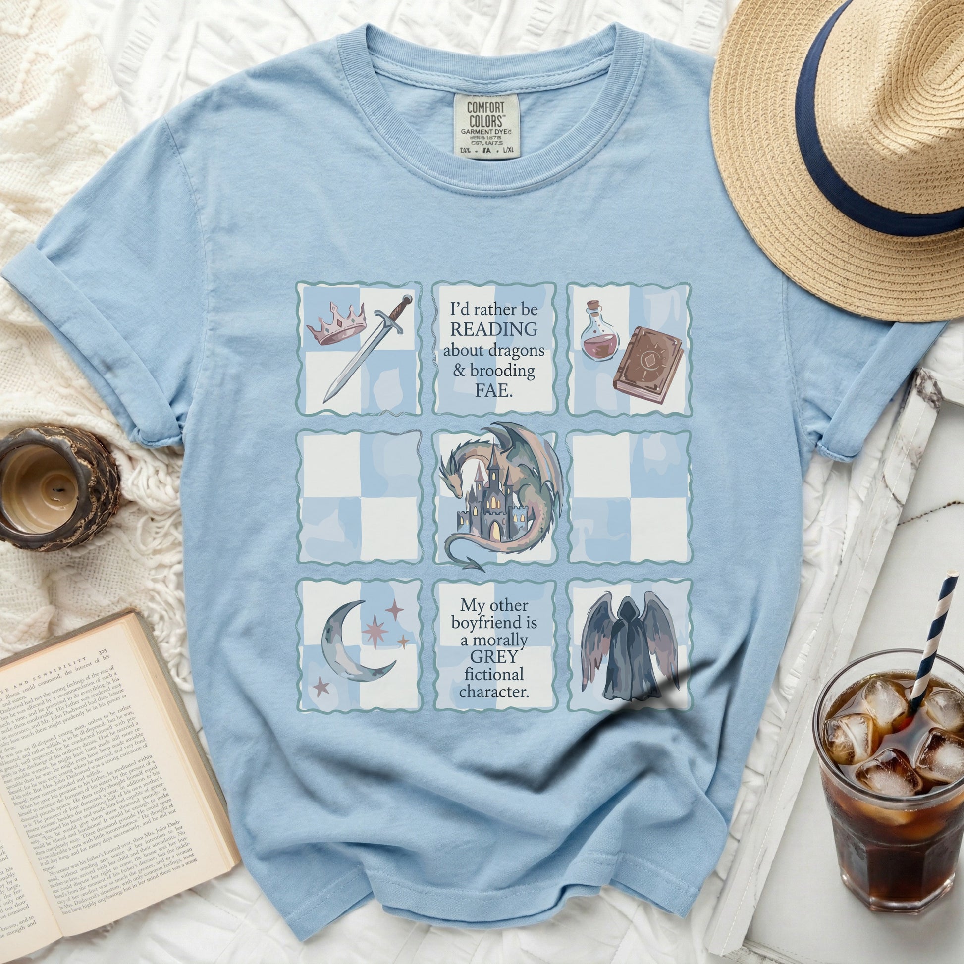 Light blue t-shirt with "I'd rather be reading about dragons & brooding FAE." and other text.