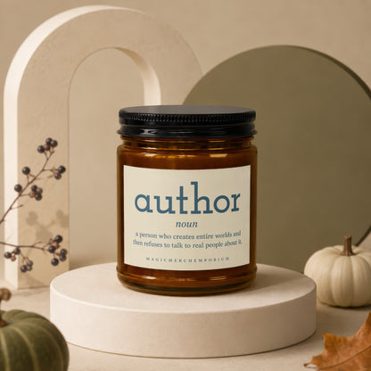 Brown glass candle labeled "author" with definition and "MAGICMERCHEMPORIUM".