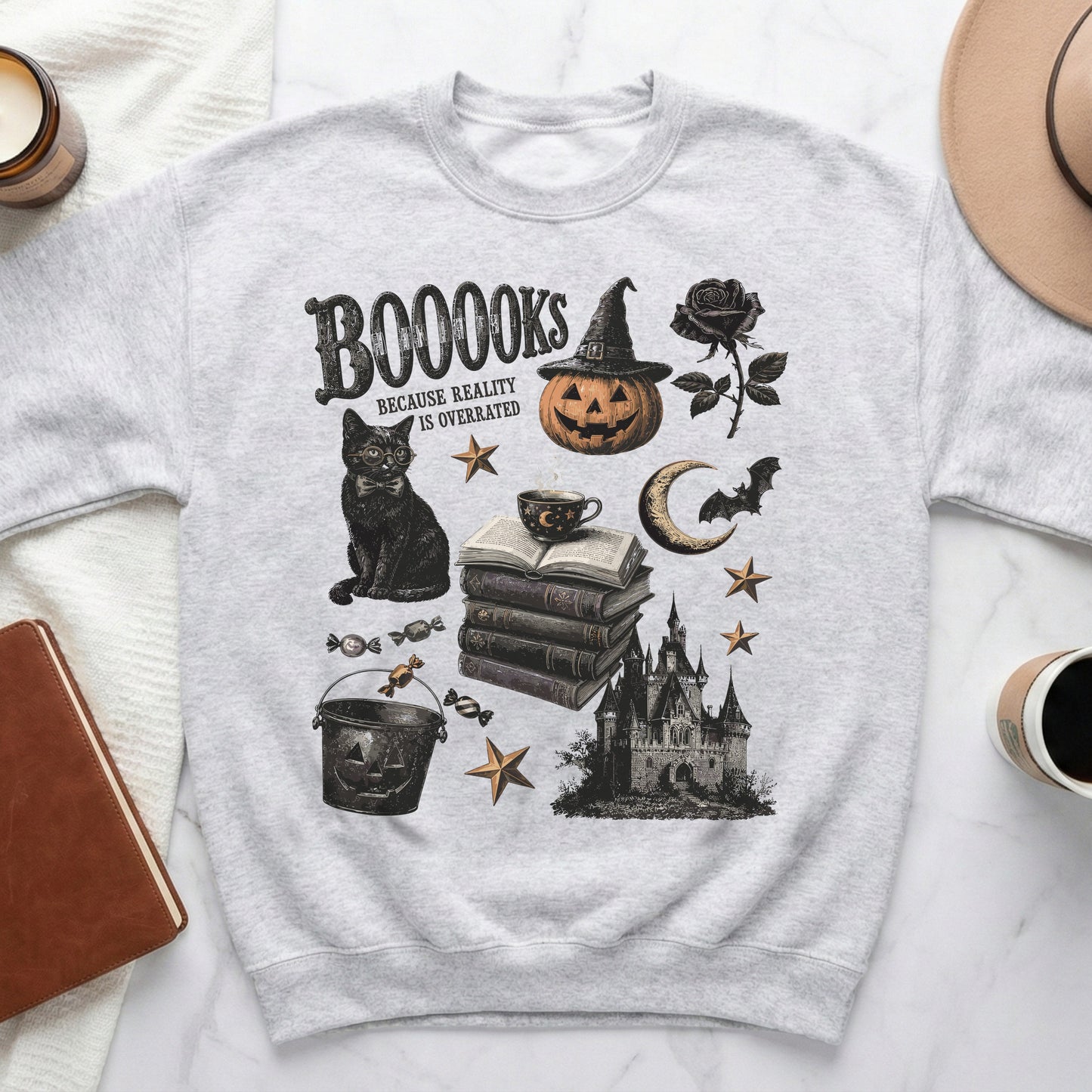 Grey sweatshirt with Halloween-themed graphics and "BOOOOKS BECAUSE REALITY IS OVERRATED" text.