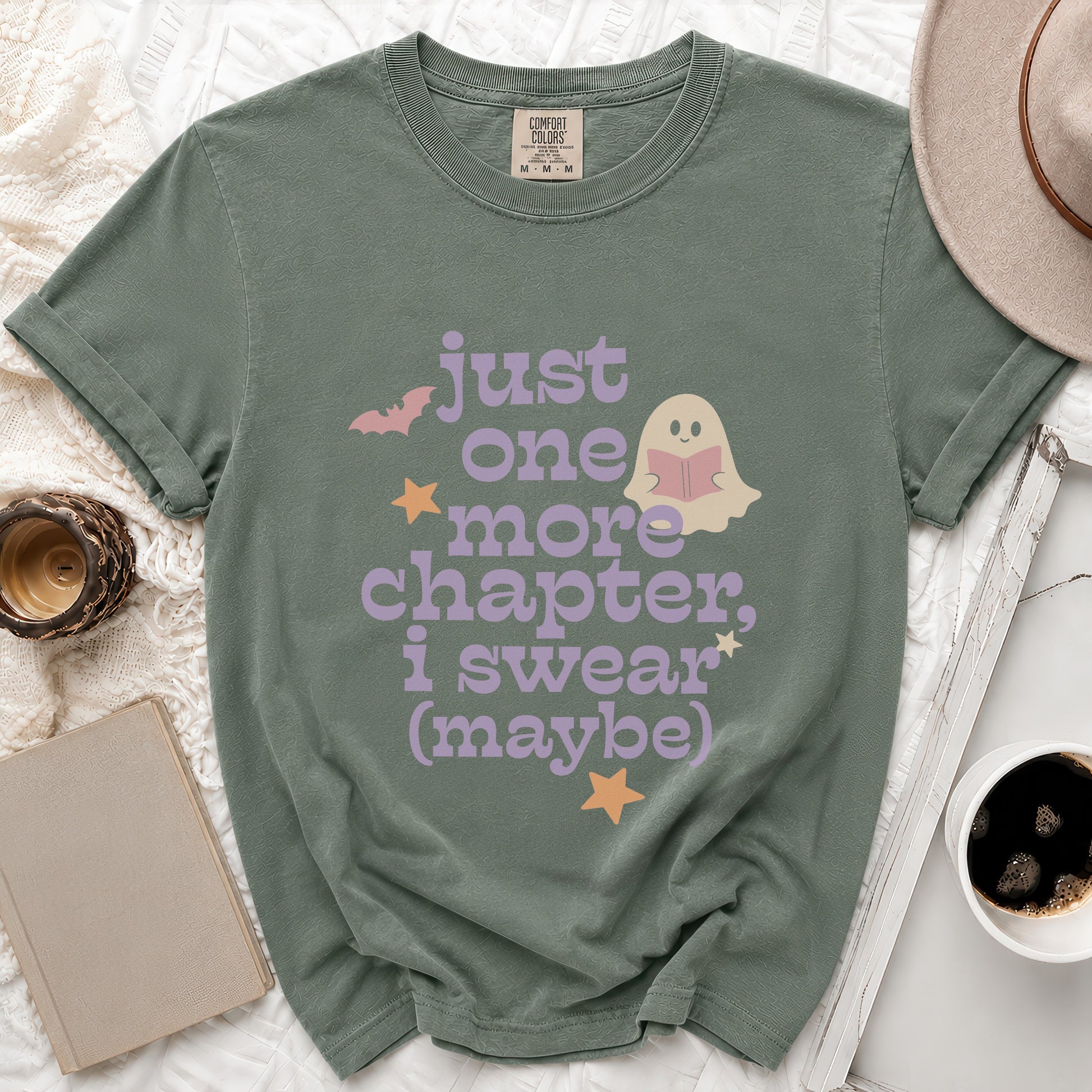 Green t-shirt with "just one more chapter, i swear (maybe)" text and ghost.