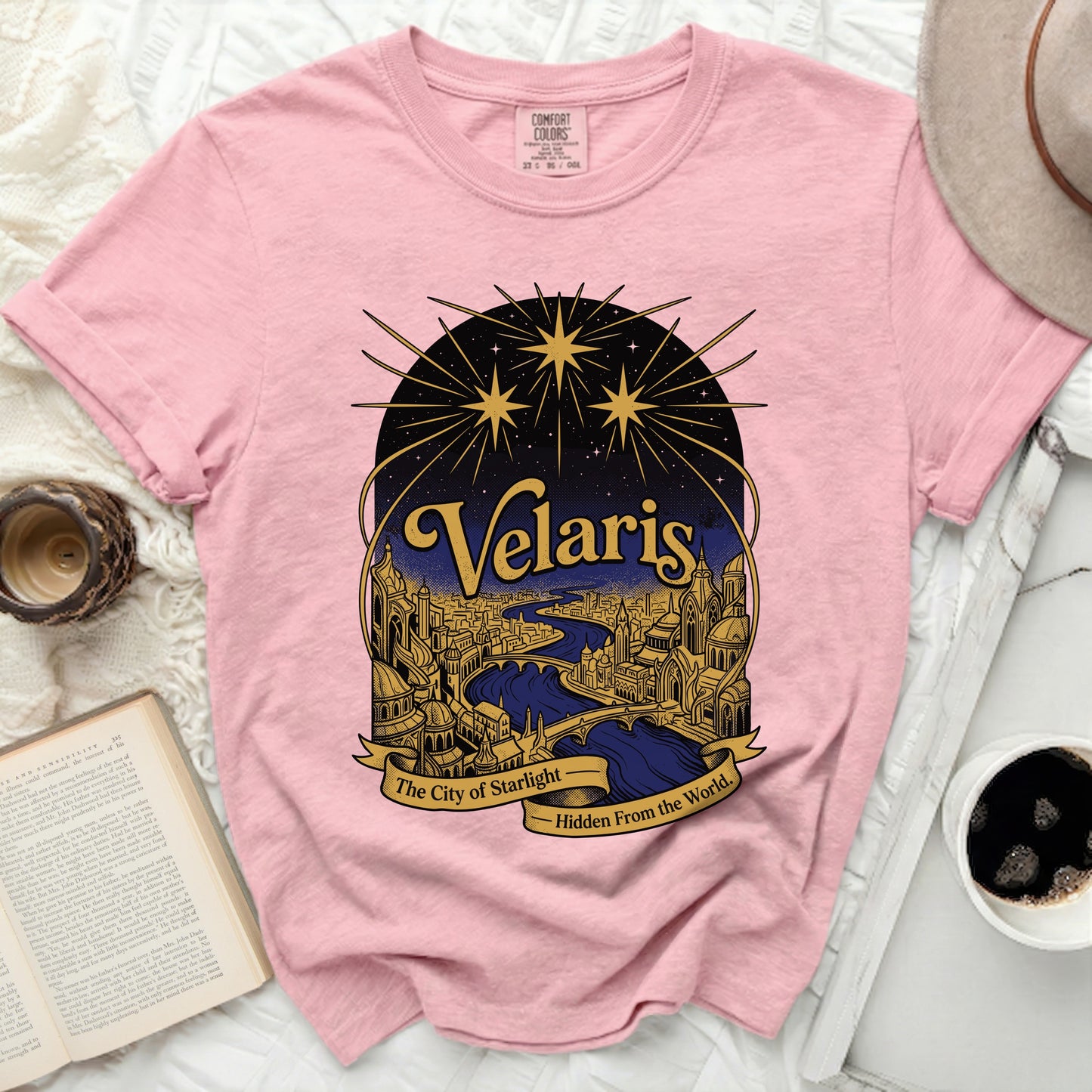 Pink Comfort Colors t-shirt with "Velaris The City of Starlight Hidden From the World" graphic.