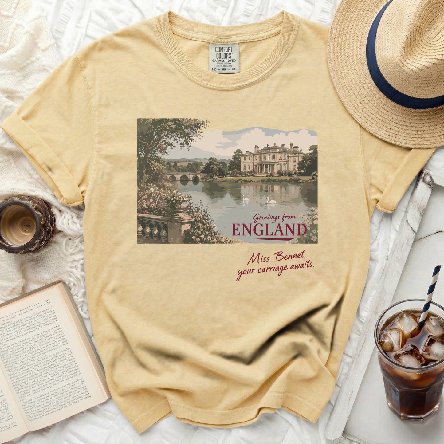 Yellow Comfort Colors t-shirt with "Greetings from England. Miss Bennet, your carriage awaits" graphic.