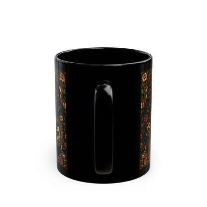 Black mug with decorative floral band on the sides.