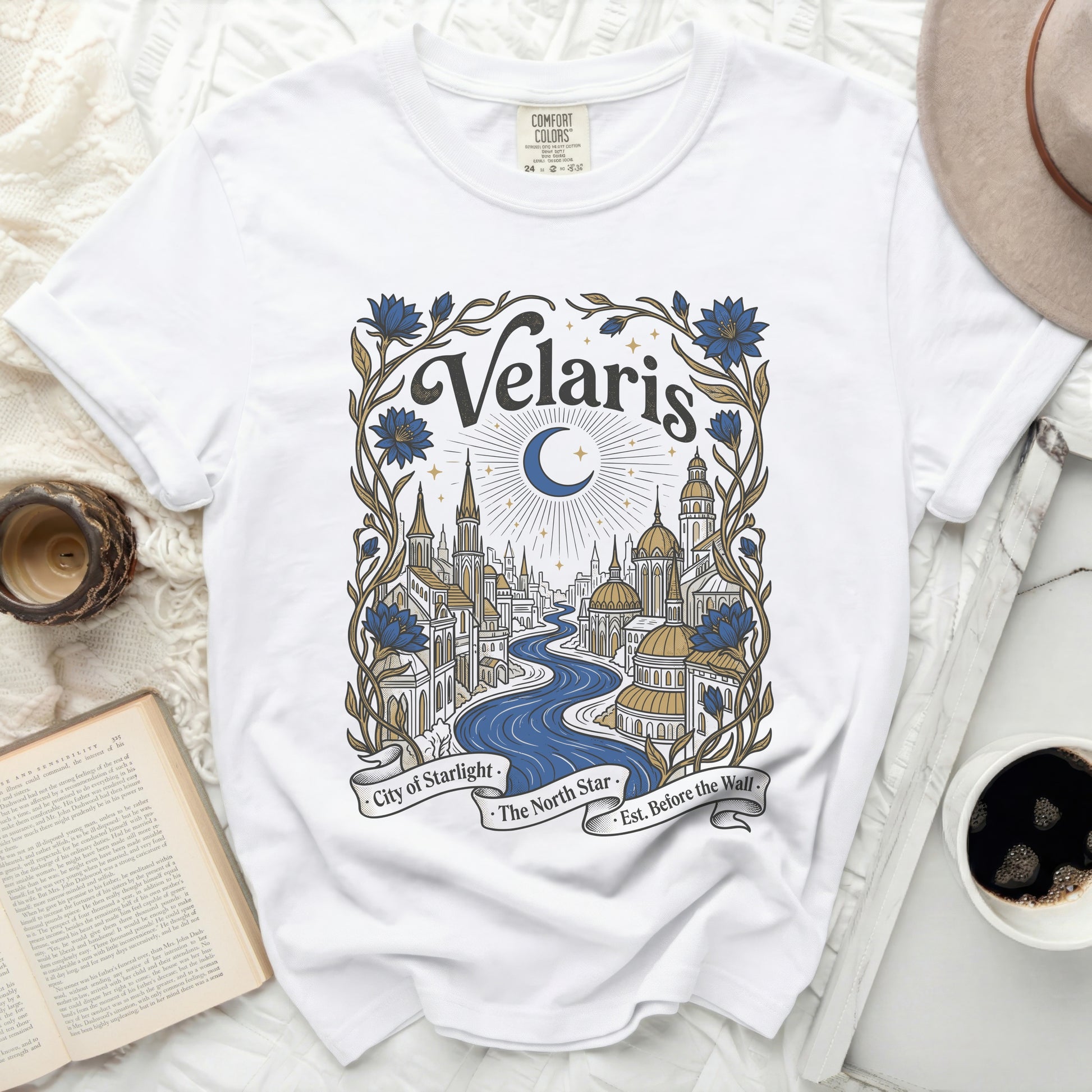 White t-shirt with "Velaris City of Starlight The North Star Est. Before the Wall" graphic.