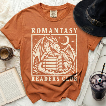 Orange t-shirt with "Romantasy Readers Club" and a dragon design.