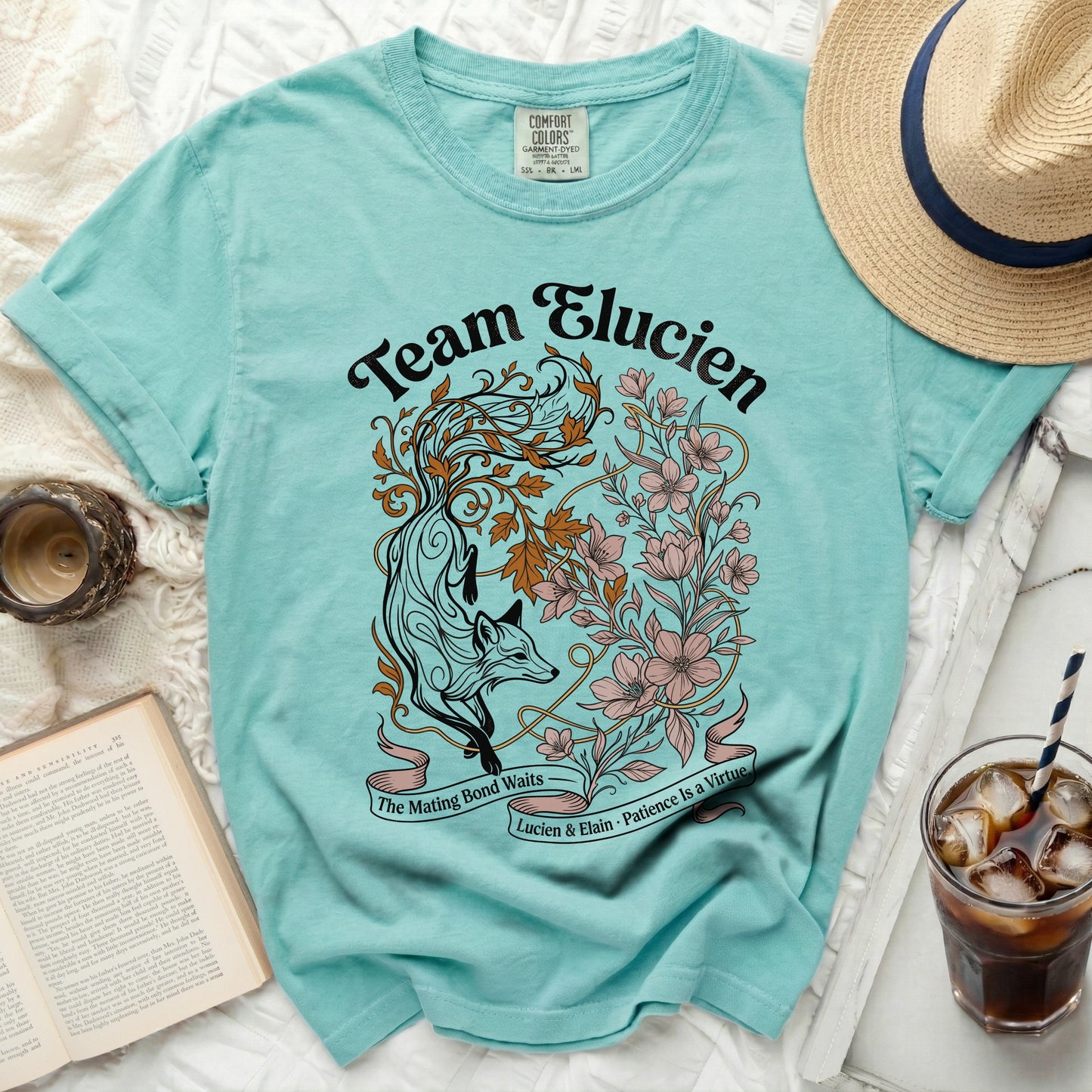 Teal t-shirt with "Team Elucien" and a fox design.