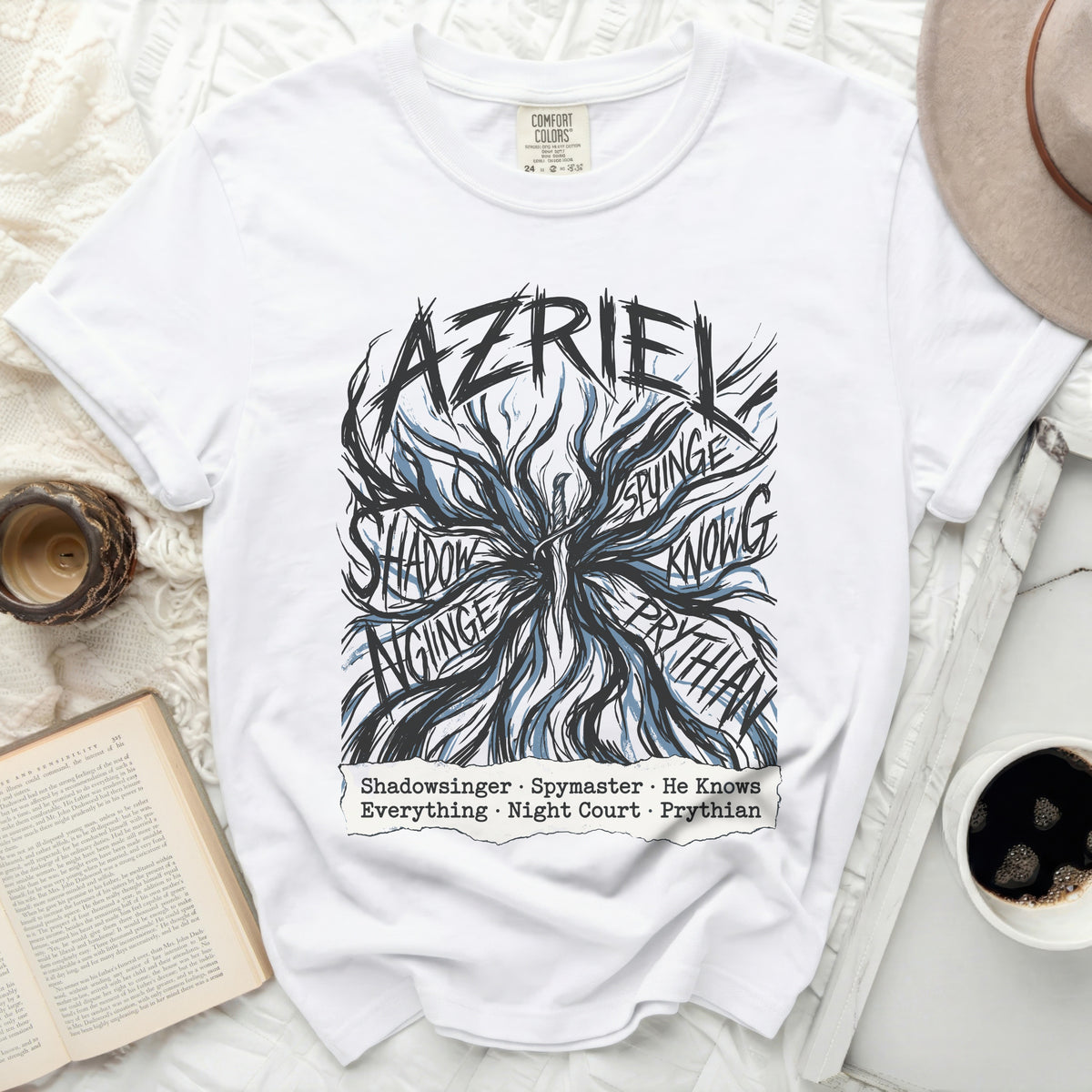 White t-shirt with black and blue "AZRIEL" graphic and character titles below.