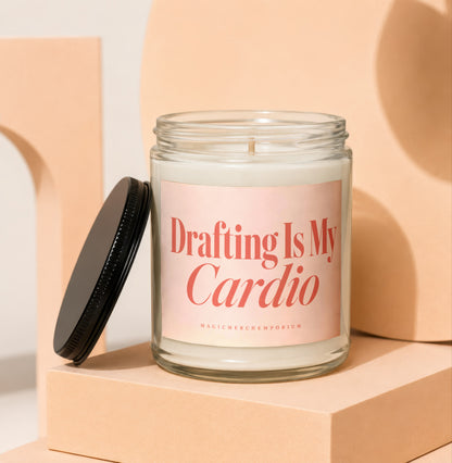Jar candle with pink label reading "Drafting Is My Cardio" from MagicMerch Emporium.