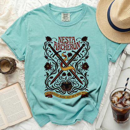 Turquoise t-shirt with "Nesta Archeron" text and sword design.