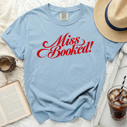 Light blue t-shirt with red cursive text "Miss Booked!"