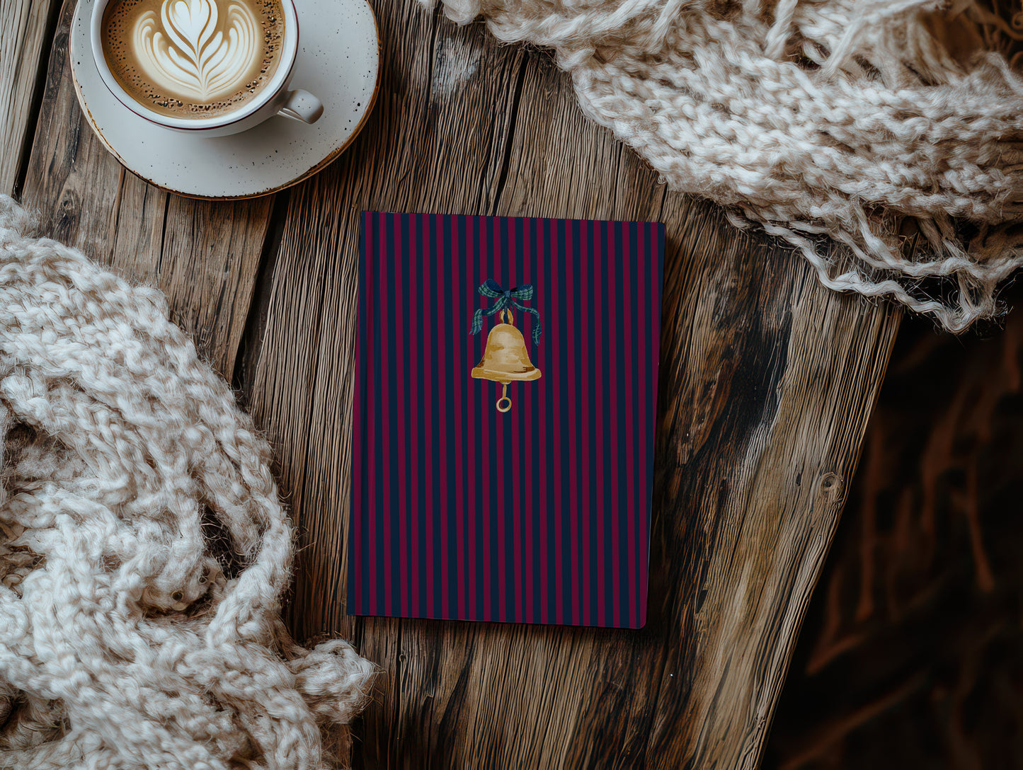 Festive striped notebook with golden bell design