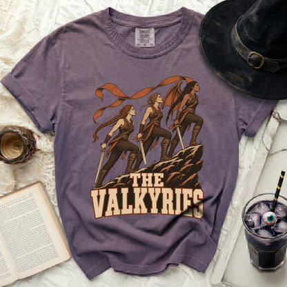 Purple t-shirt with illustration of three Valkyries and text "THE VALKYRIES".