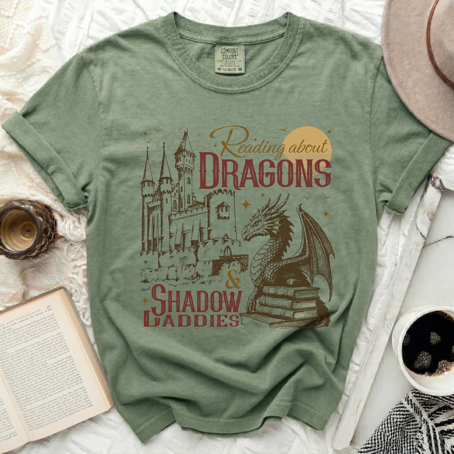 Comfort Colors shirt with "Reading about DRAGONS & SHADOW DADDIES" graphic.