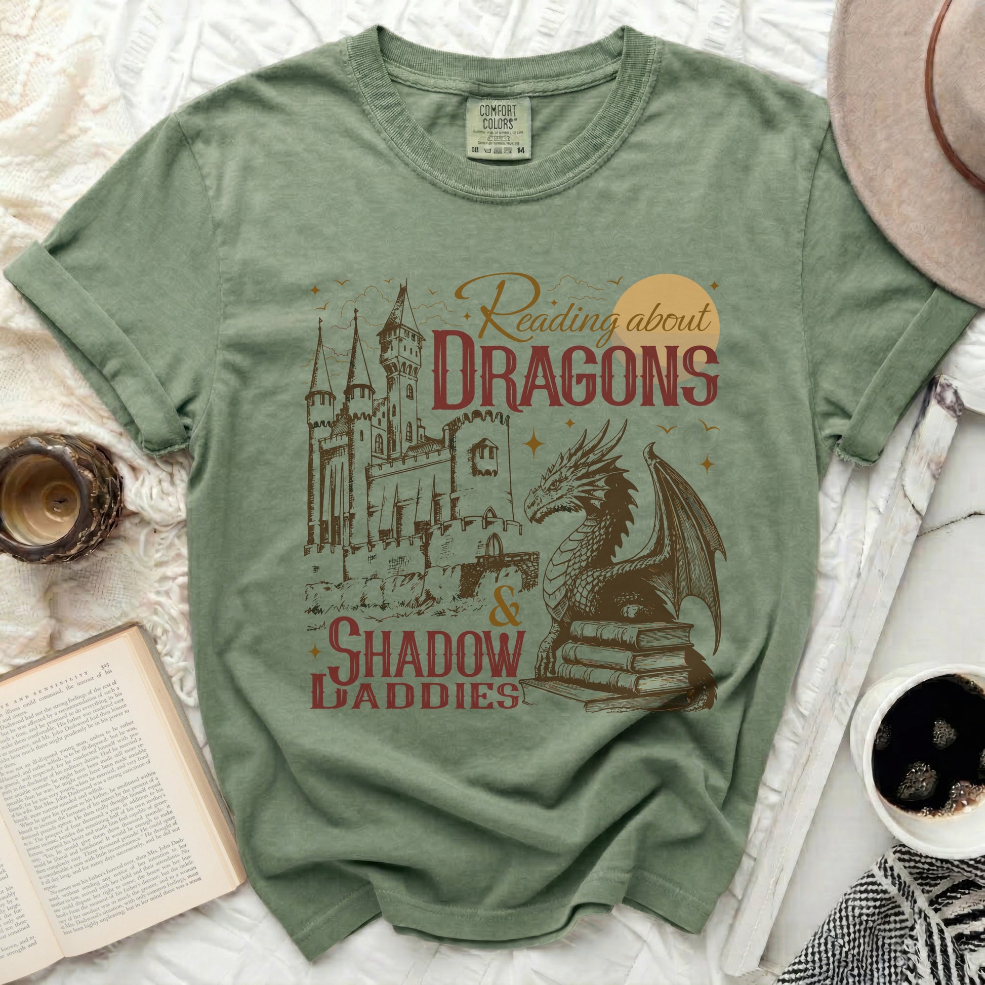 Comfort Colors shirt with "Reading about DRAGONS & SHADOW DADDIES" graphic.