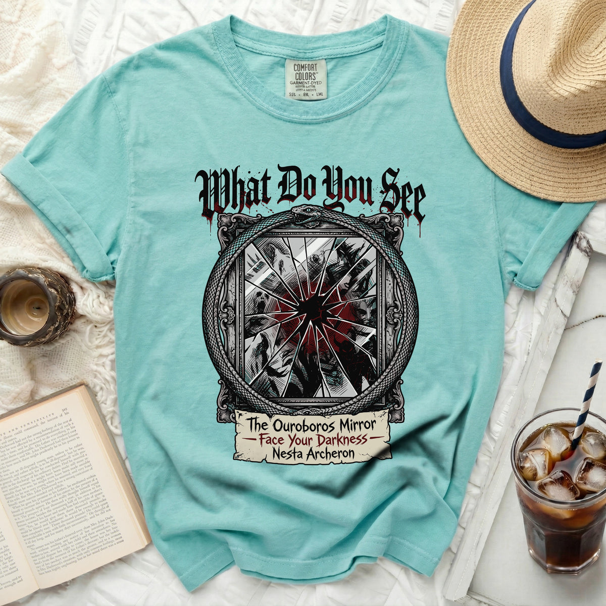 Teal t-shirt with "What Do You See, The Ouroboros Mirror" graphic.
