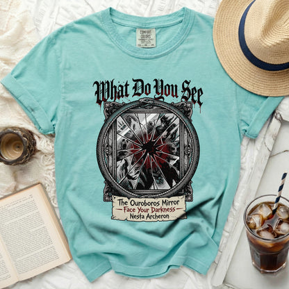 Teal t-shirt with "What Do You See, The Ouroboros Mirror" graphic.