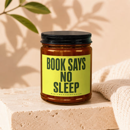 Brown candle with black lid, yellow label reads "BOOK SAYS NO SLEEP".