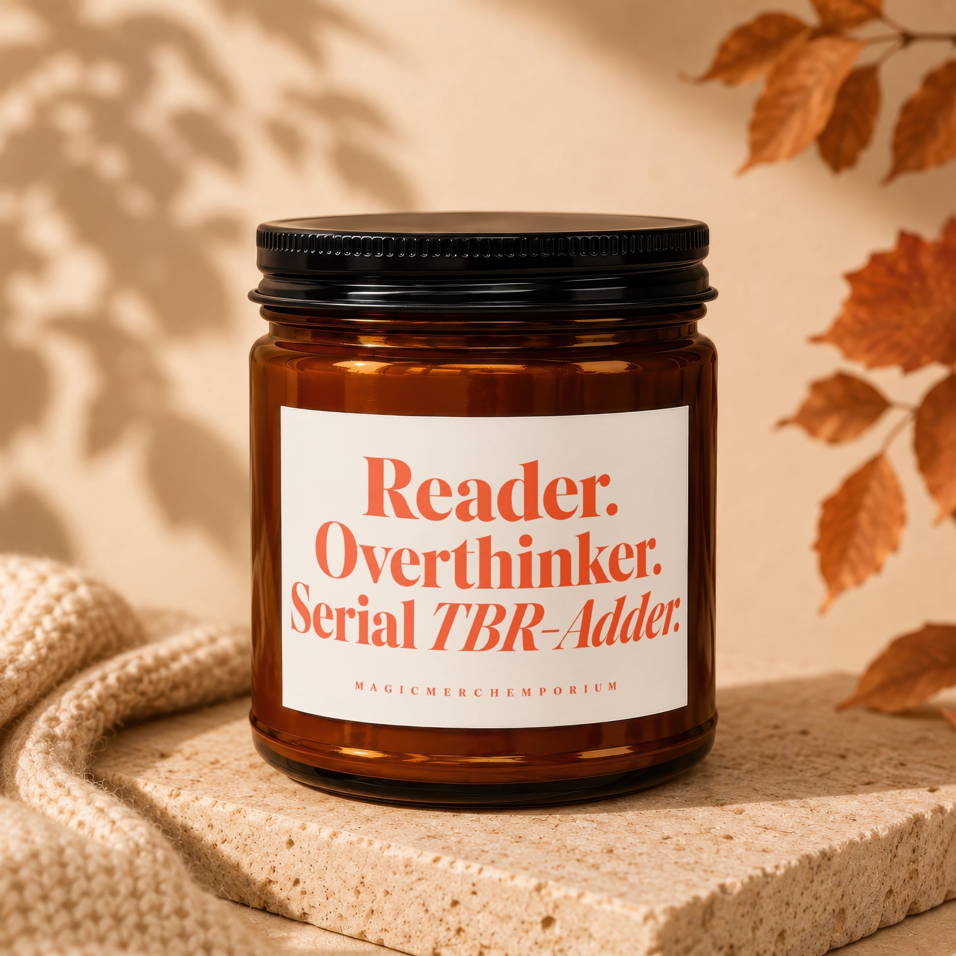 Amber jar candle with text "Reader. Overthinker. Serial TBR-Adder."