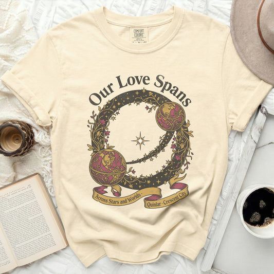Cream t-shirt with "Our Love Spans Across Stars and Worlds" graphic.