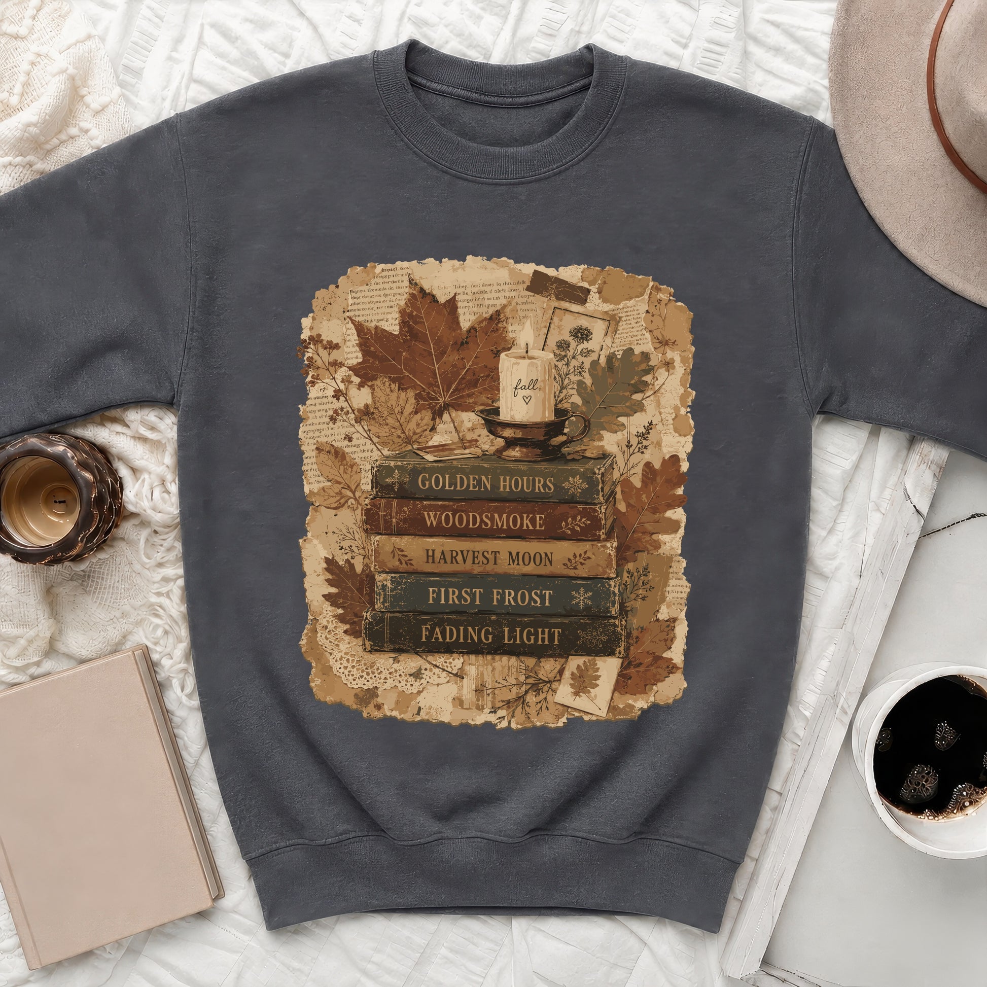 Dark grey sweatshirt with vintage-style fall graphic featuring books and candle.