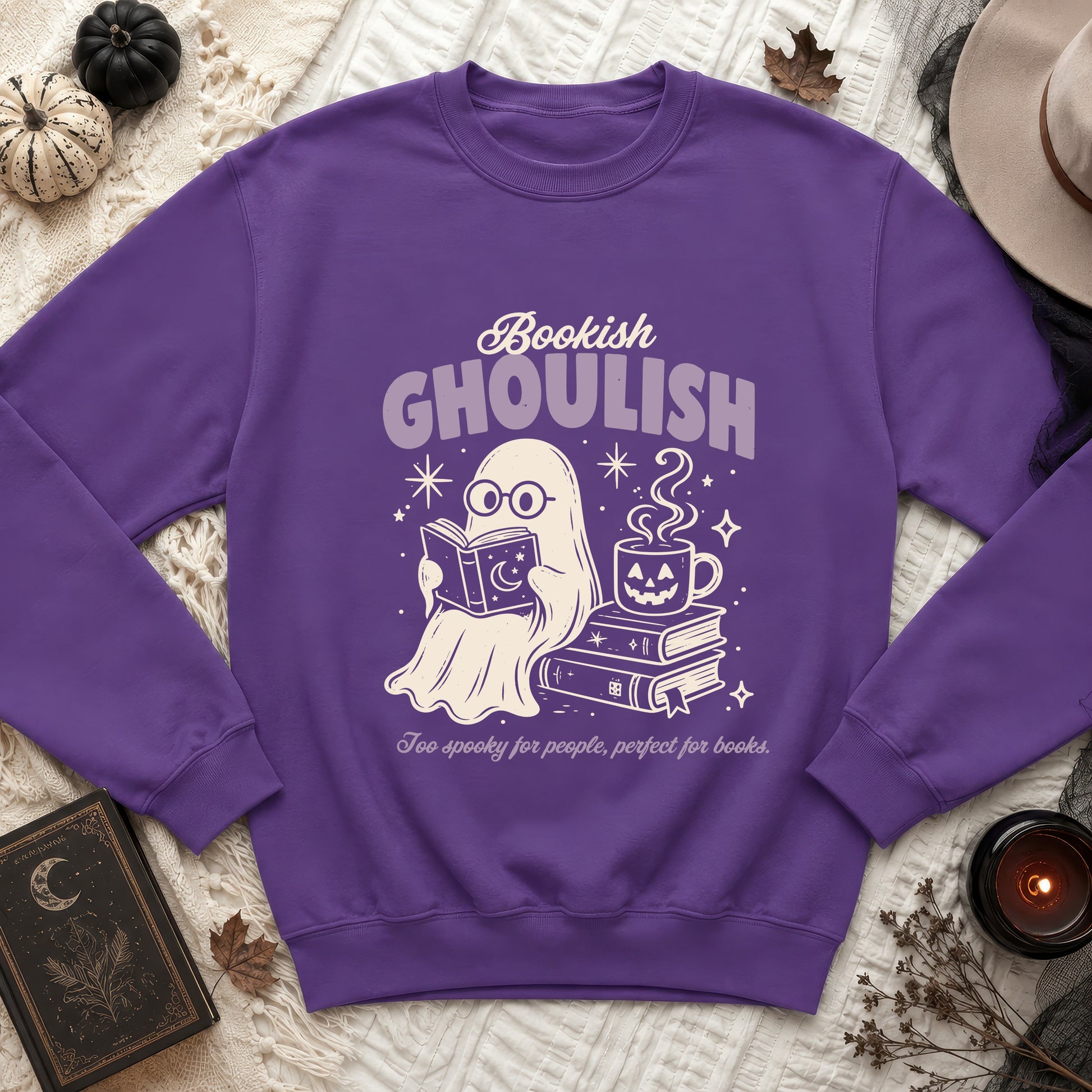 Purple crewneck sweatshirt with ghost reading book and text "Bookish Ghoulish".