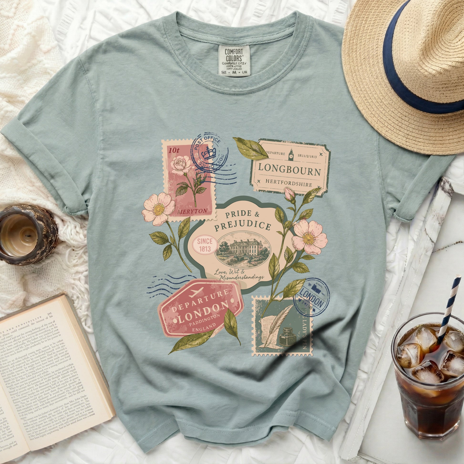 Green t-shirt with "Pride and Prejudice" vintage postal stamps and flowers design.